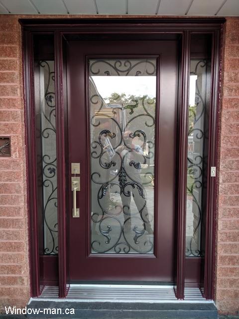 Front door and two sidelights. Single front entry steel insulated. Spray booth paint. Burgundy color. Professionally installed. Westham wrought iron glass inserts